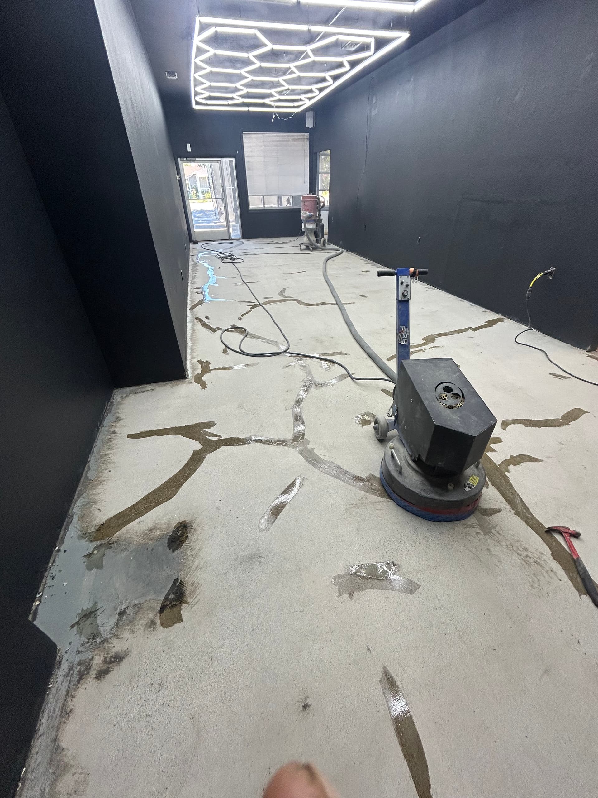 Cracked Concrete to High-Gloss Black Epoxy in a Commercial Space