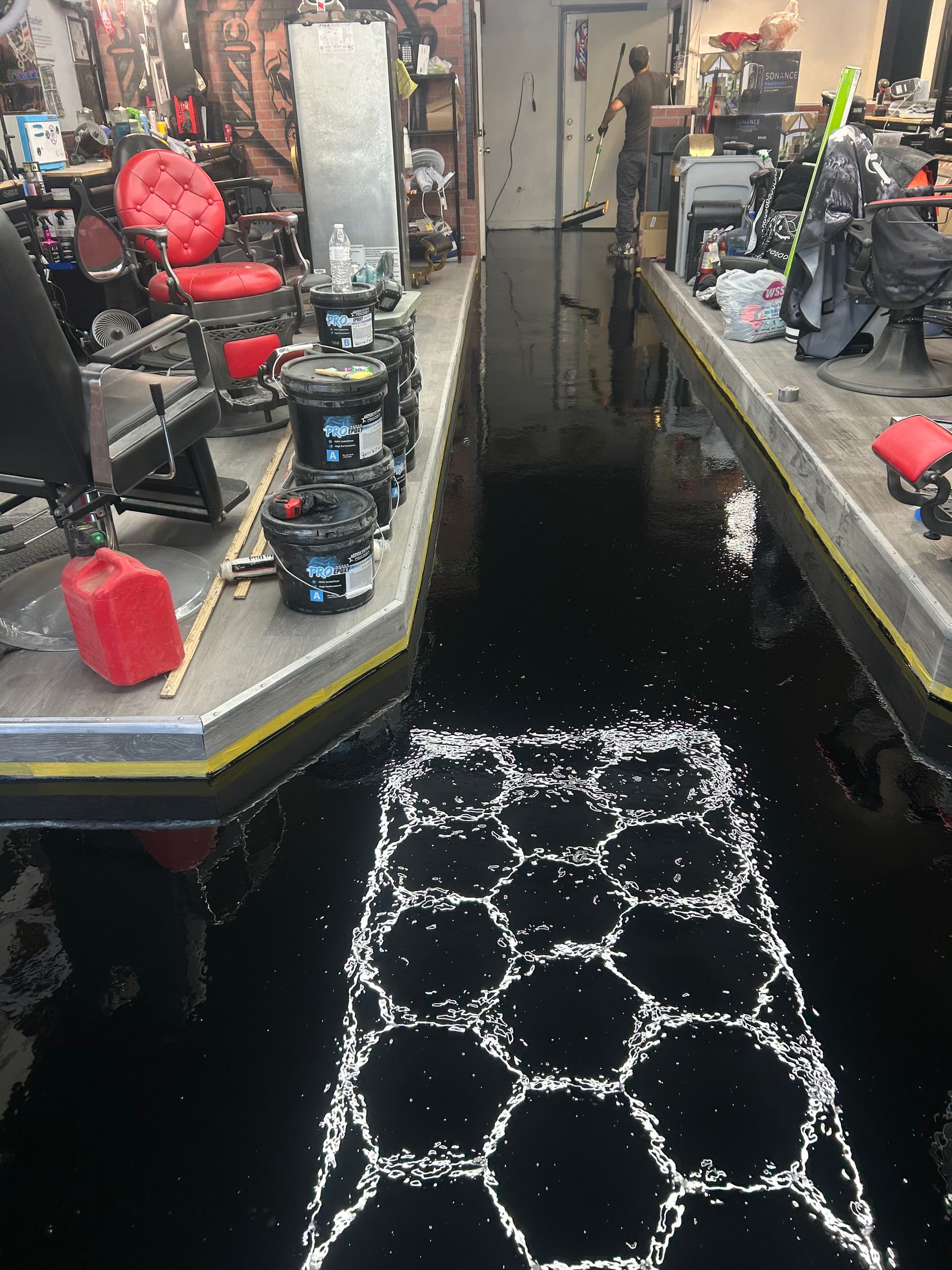 Gallery photos for Cracked Concrete to High-Gloss Black Epoxy in a Commercial Space: Image #5