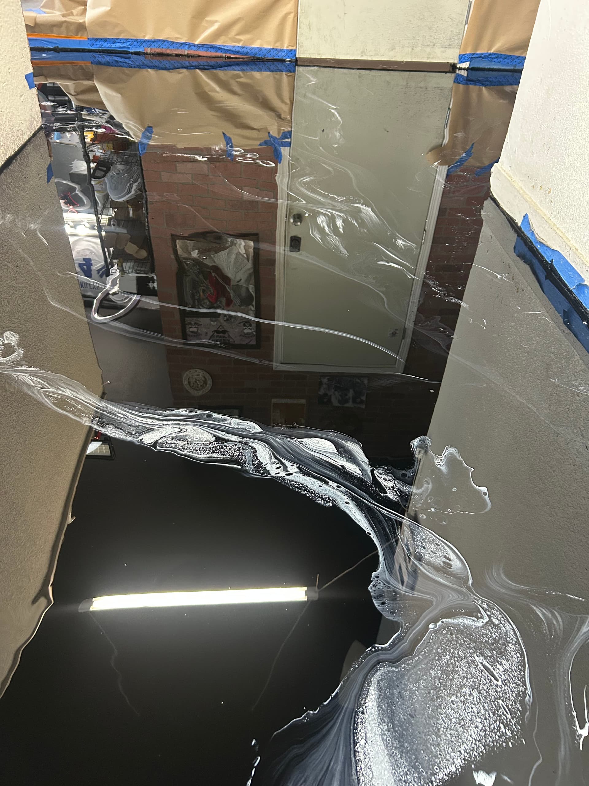 Gallery photos for Cracked Concrete to High-Gloss Black Epoxy in a Commercial Space: Image #7