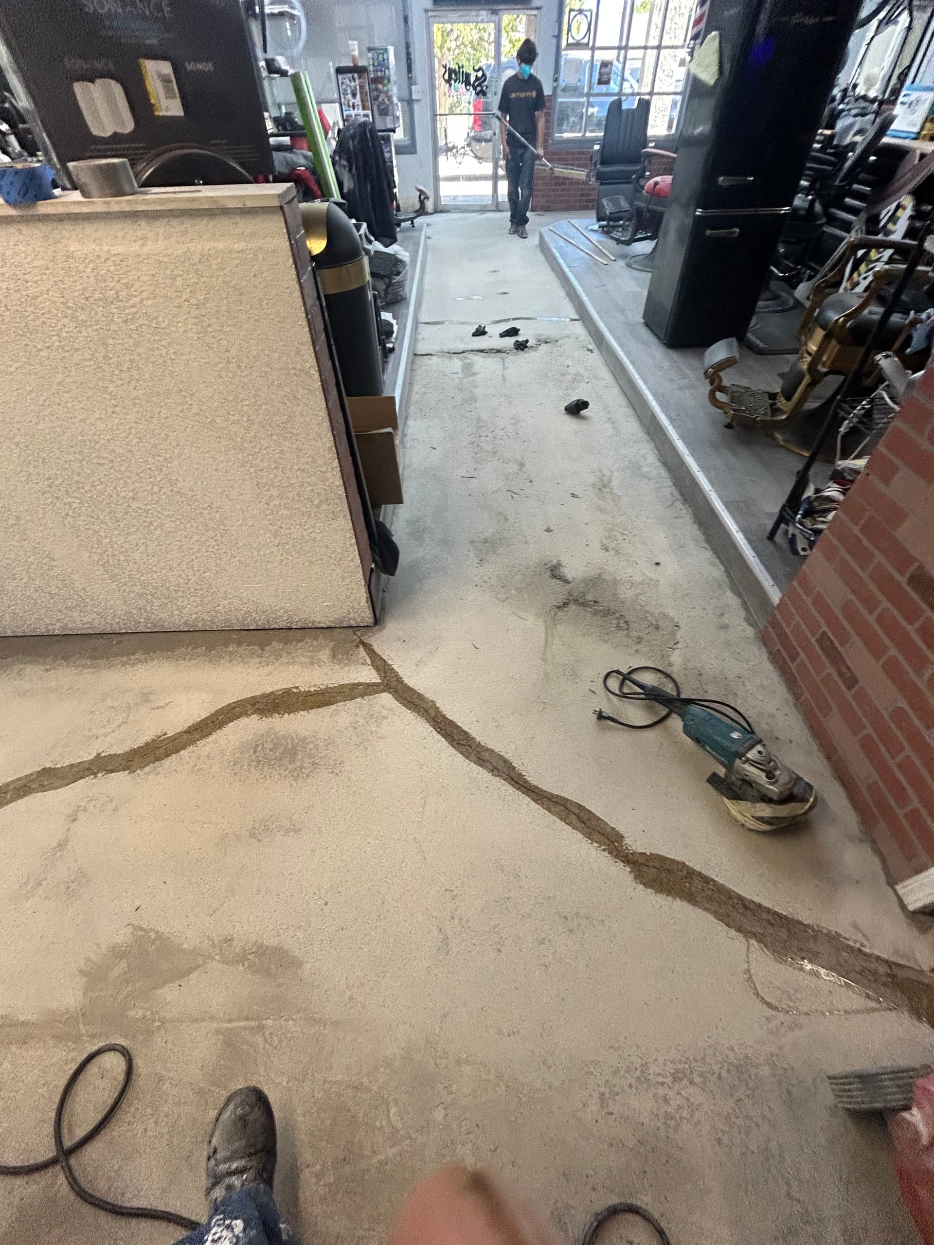 Gallery photos for Cracked Concrete to High-Gloss Black Epoxy in a Commercial Space: Image #1