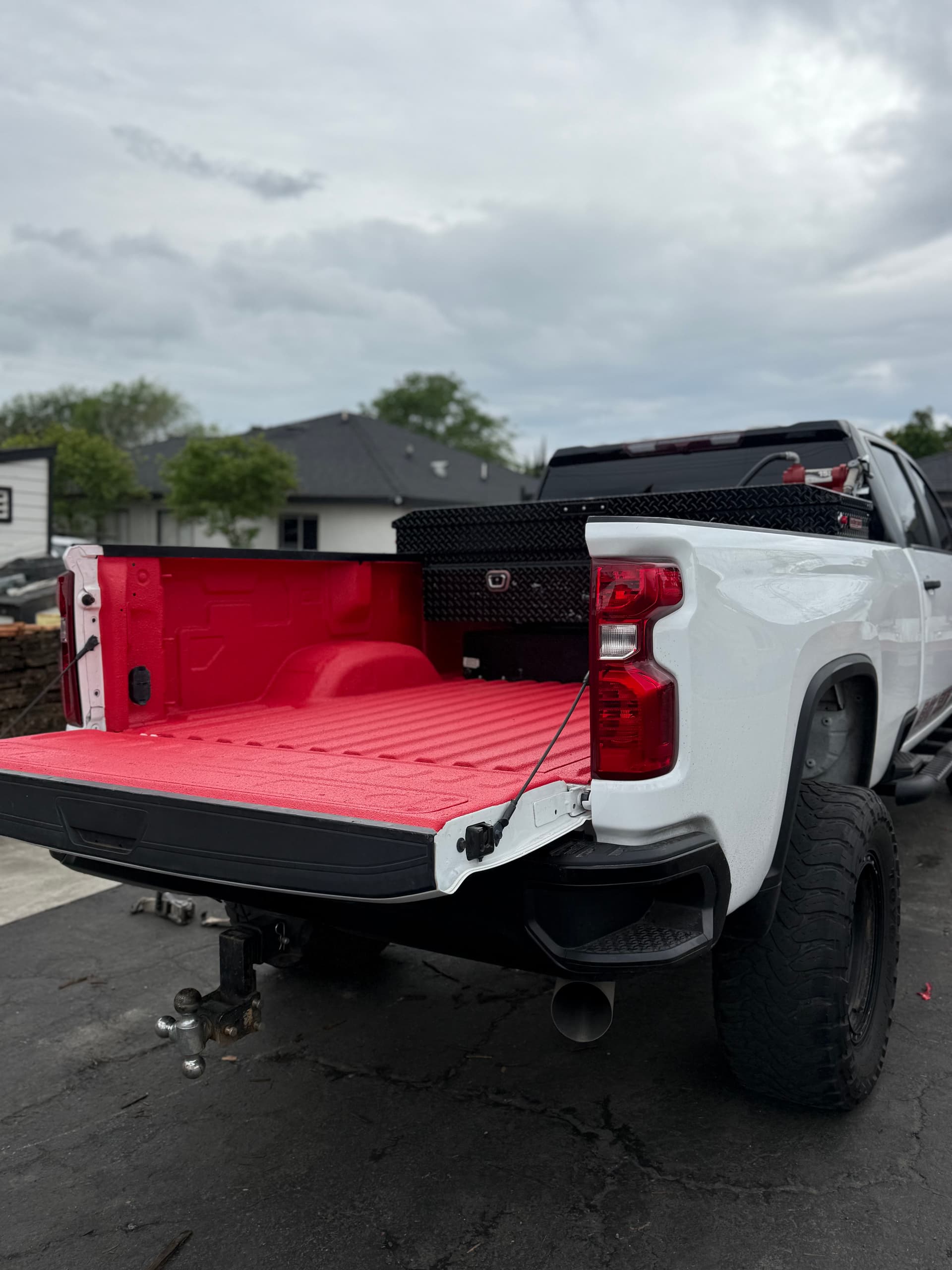 Gallery photos for Custom Red Pigmented Bedliner on a Chevy 2500 HD: Image #1